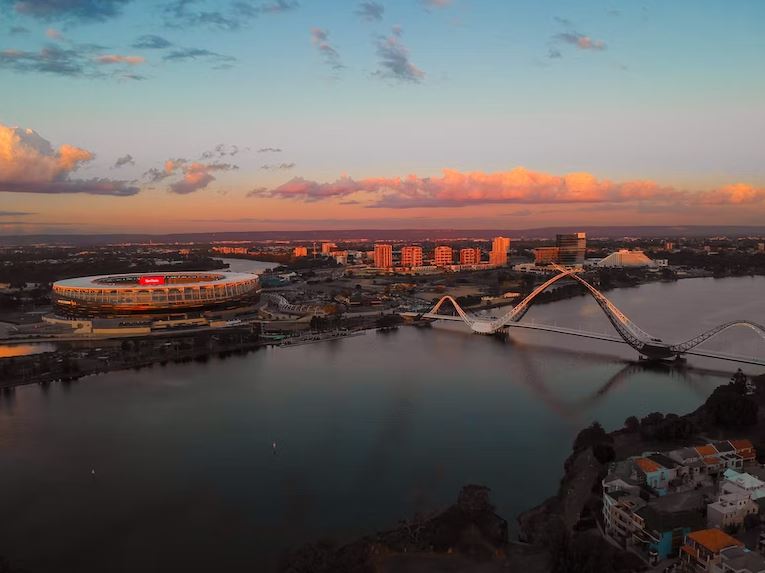 Sunset over the Perth Hills. Optus Stadium and Matagarup Bridge in View